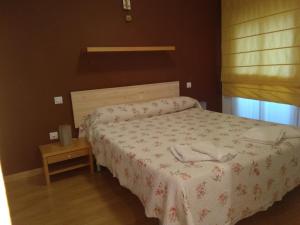 A bed or beds in a room at El Patio