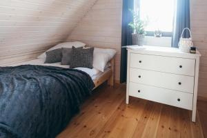 Postel nebo postele na pokoji v ubytování Rozmaryn