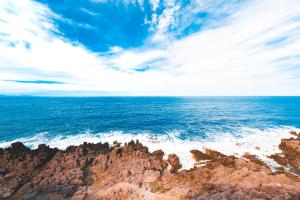 a view of the ocean from a rocky beach at Taliammari in Cefalù