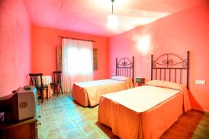 Ένα ή περισσότερα κρεβάτια σε δωμάτιο στο Casa Rural Las Gamellas