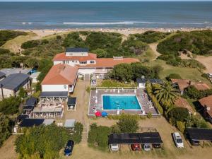 an aerial view of a house with a swimming pool and the beach at Amelia in Ostende