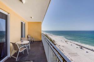 a balcony with a table and a view of the beach at Sterling Reef 2 in Panama City Beach