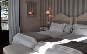 Postel nebo postele na pokoji v ubytování Hotel Rural La Raposera