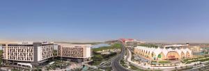 an aerial view of a city with buildings at Radisson Blu Hotel, Abu Dhabi Yas Island in Abu Dhabi