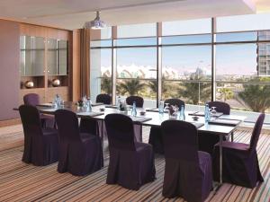 a conference room with a long table and chairs at Radisson Blu Hotel, Abu Dhabi Yas Island in Abu Dhabi