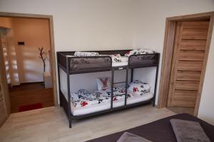 Postel nebo postele na pokoji v ubytování Apartman Biskupice
