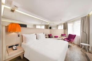 Voodi või voodid majutusasutuse Radisson Blu Béke Hotel, Budapest toas
