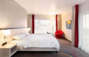 A bed or beds in a room at Hotel Park Inn by Radisson Brussels Midi