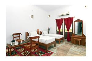 Voodi või voodid majutusasutuse Satyam Palace Resort toas