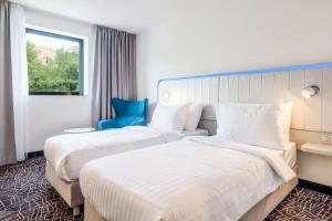 Postel nebo postele na pokoji v ubytování Park Inn by Radisson Danube Bratislava