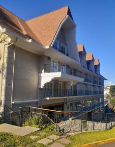 a large building with balconies on the side of it at Hotel Daara in Gramado