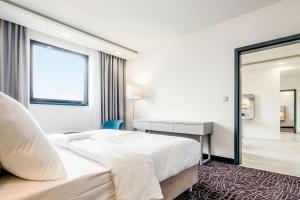 Postel nebo postele na pokoji v ubytování Park Inn by Radisson Danube Bratislava