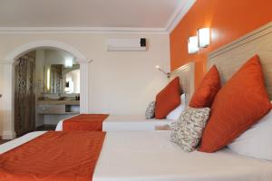 Letto o letti in una camera di Hotel Flamingo Irapuato
