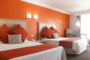 Letto o letti in una camera di Hotel Flamingo Irapuato