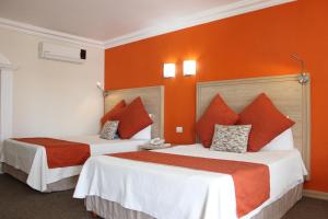 Letto o letti in una camera di Hotel Flamingo Irapuato