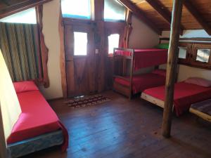 
Una cama o camas cuchetas en una habitación  de Huecubu Public House
