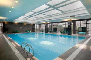 a large swimming pool in a building at Holiday Inn Temple Of Heaven Beijing, an IHG Hotel in Beijing