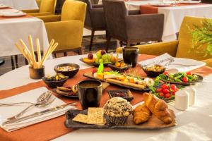 a table with a bunch of food on it at Radisson Blu Hotel, Diyarbakir in Diyarbakır