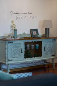 a blue cabinet with a lamp on top of it at Avenida Central - Coimbra Accommodation in Coimbra