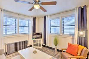 a living room with a ceiling fan and windows at Upscale Apt at The Lofts in Historic Downtown Lead in Lead