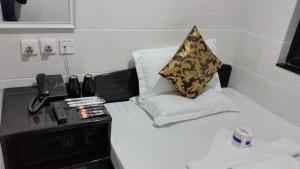 Ένα ή περισσότερα κρεβάτια σε δωμάτιο στο Super Guest House