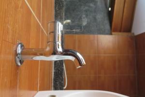 a bathroom sink with a faucet in a bathroom at Tapada in Gili Islands