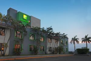 a hotel with a sign on the side of it at Holiday Inn Tampico-Altamira, an IHG Hotel in Tampico