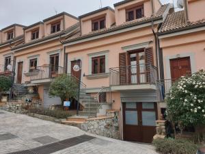 a row of houses in a street at Demetra Residence in Enna