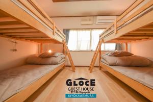 Postel nebo postele na pokoji v ubytování GLOCE 宮ヶ瀬 モビリティゲストハウス l Miyagase Mobility Guest House