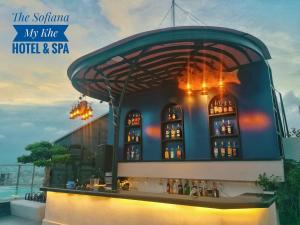 a building with a bar with lights on it at Sofiana My Khe Hotel & Spa- Rooftop Pool Bar in Danang