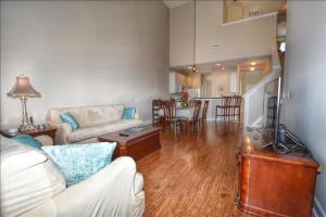 a living room with a couch and a table at 2215 The Havens townhouse in Myrtle Beach +13 photos