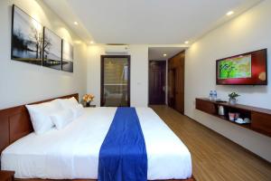Un pat sau paturi într-o cameră la Sol Villa