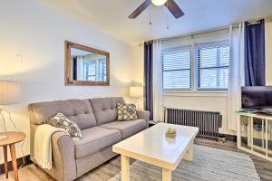 a living room with a couch and a table at Upscale Apt at The Lofts in Historic Downtown Lead in Lead