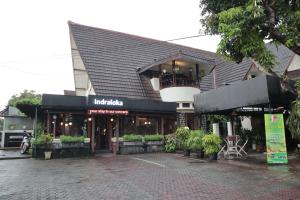 a building with plants in front of it at Indraloka Heritage Homestay in Yogyakarta