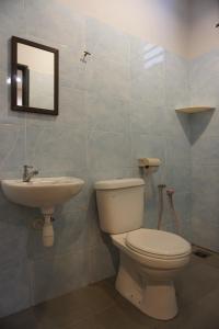 a bathroom with a toilet and a sink at S & S Guest House Kuantan in Kuantan
