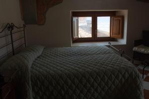 Un pat sau paturi într-o cameră la Villa Cosilinum