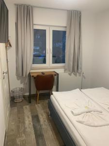 Postel nebo postele na pokoji v ubytování Grüner Baum