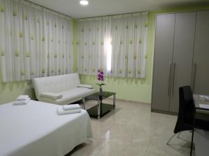 Postel nebo postele na pokoji v ubytování Hotel Primavera