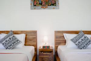 WIRA Homestay & Spa客房内的一张或多张床位