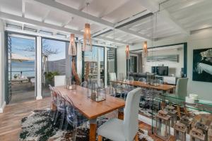 a dining room with a table and chairs at TH40 Thesen Islands in Knysna