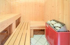 a sauna with a bench and a trash can at 3 Bedroom Nice Home In Humble in Humble