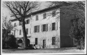 a black and white photo of a building with a tree at Agriturismo La Filanda in Manerba del Garda