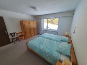 Rúm í herbergi á Apartment in Lenzerheide