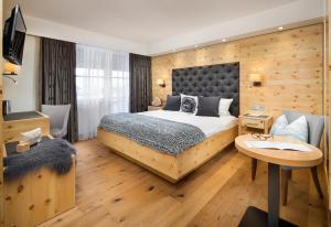 Postel nebo postele na pokoji v ubytování Hotel Weinbauer