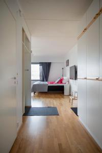 a bedroom with a bed in a room at 2ndhomes Katajanokka Apartment with Seaview and Sauna in Helsinki