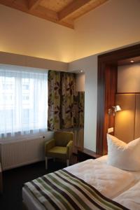 Postel nebo postele na pokoji v ubytování Hotel Alea City
