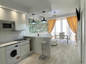 a kitchen and living room with a washer and dryer at Plaza Madrid Central in Madrid