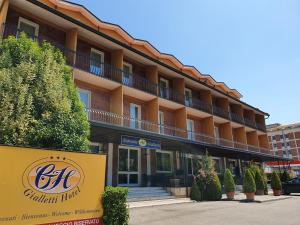 a hotel building with a sign in front of it at Hotel Gialletti in Orvieto