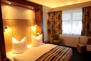 Postel nebo postele na pokoji v ubytování Hotel Alea City