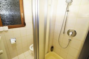 a bathroom with a shower and a toilet at Apartment Möhringen in Stuttgart